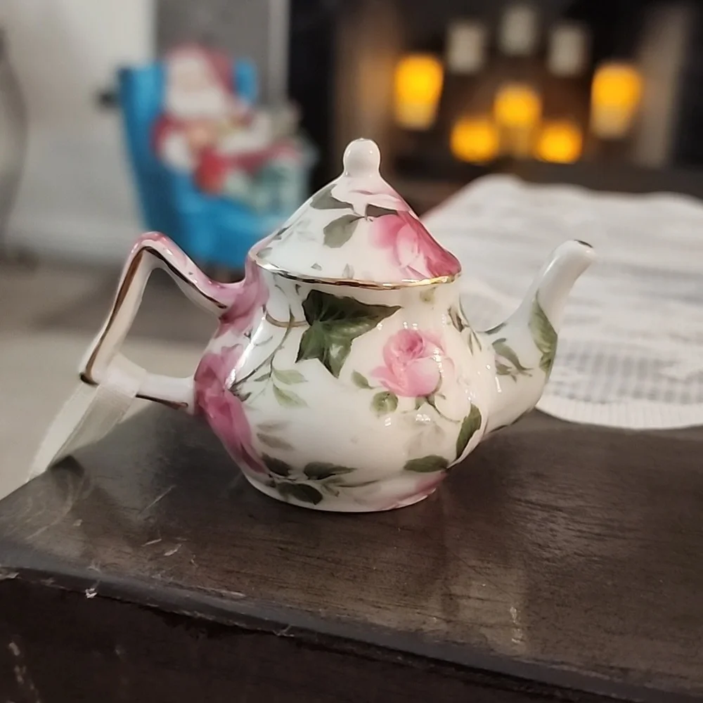 Christmas ornaments, miniature tea cups and tea pots